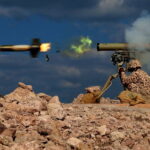 A handout photo made available by Iran's Islamic Revolutionary Guard Corps (IRGC)'s official website Sepahnews on 24 January 2025 shows a soldier firing a weapon during a military exercise in the Persian Gulf, southern Iran. Iran's Revolutionary Guards conducted drills in the Gulf as part of nationwide military exercises, state media reported.