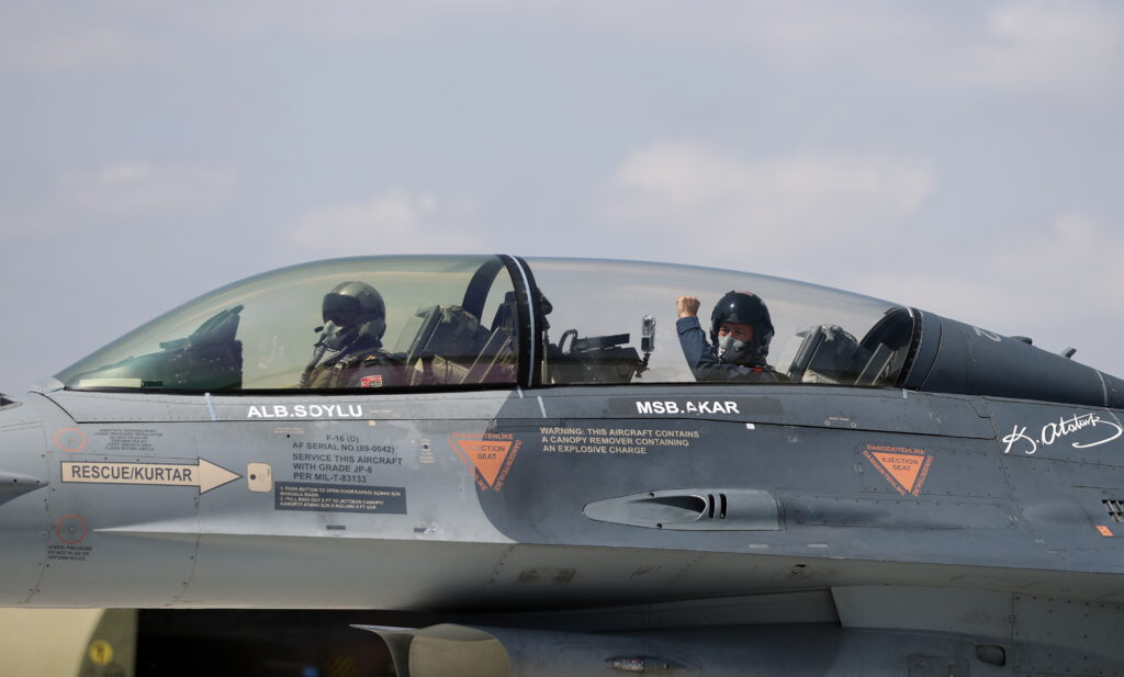 A handout photo made available by Turkish National Defense Minister Press office shows, Turkey's Defense Minister Hulusi Akar (R) gives a tumb-up while sitting inside an F-16 jet fighter during the flight of the 2022-2023 flight training year at a military air base in Eskisehir, Turkey, 02 September 2022.