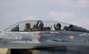 A handout photo made available by Turkish National Defense Minister Press office shows, Turkey's Defense Minister Hulusi Akar (R) gives a tumb-up while sitting inside an F-16 jet fighter during the flight of the 2022-2023 flight training year at a military air base in Eskisehir, Turkey, 02 September 2022.