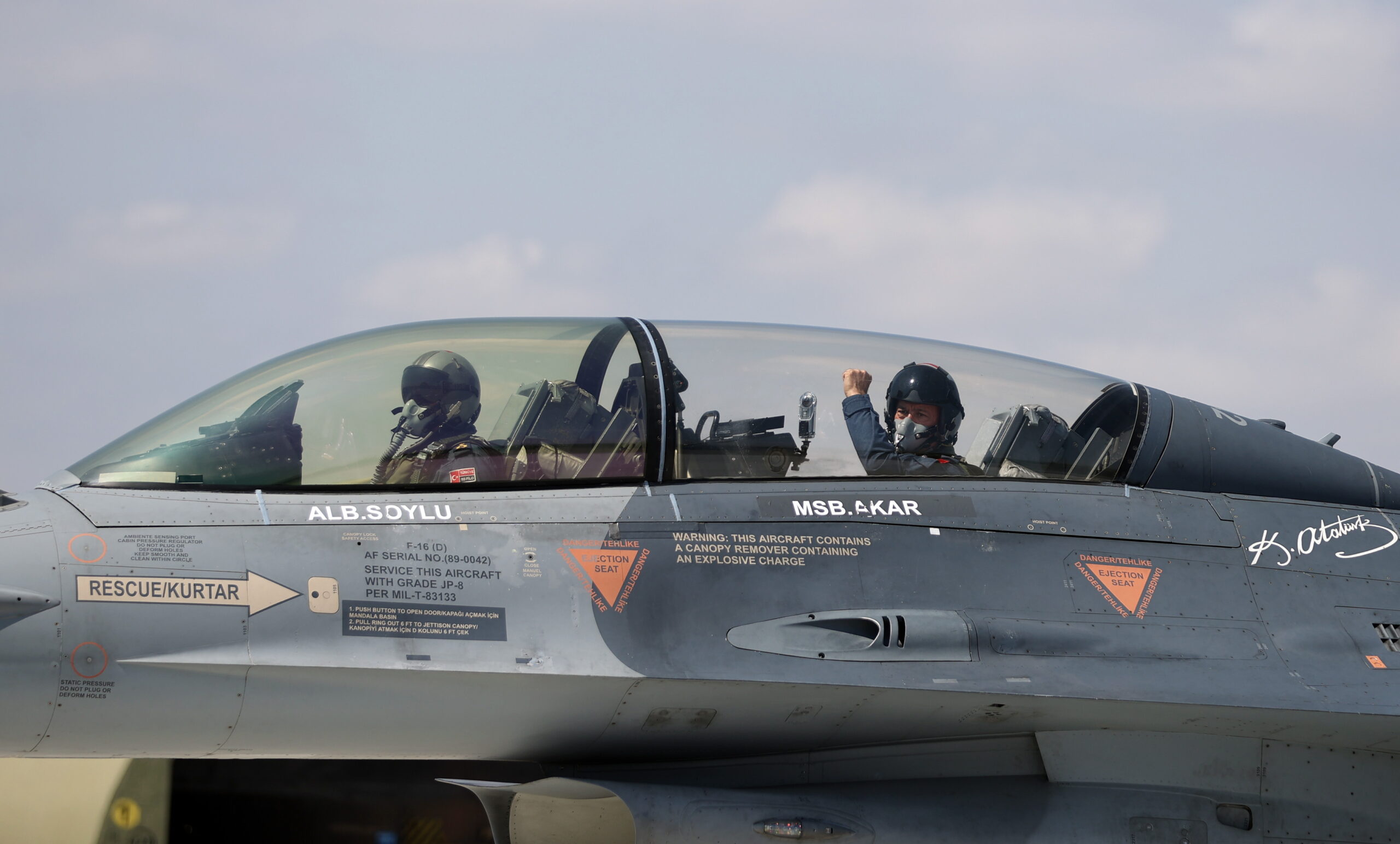 A handout photo made available by Turkish National Defense Minister Press office shows, Turkey's Defense Minister Hulusi Akar (R) gives a tumb-up while sitting inside an F-16 jet fighter during the flight of the 2022-2023 flight training year at a military air base in Eskisehir, Turkey, 02 September 2022.