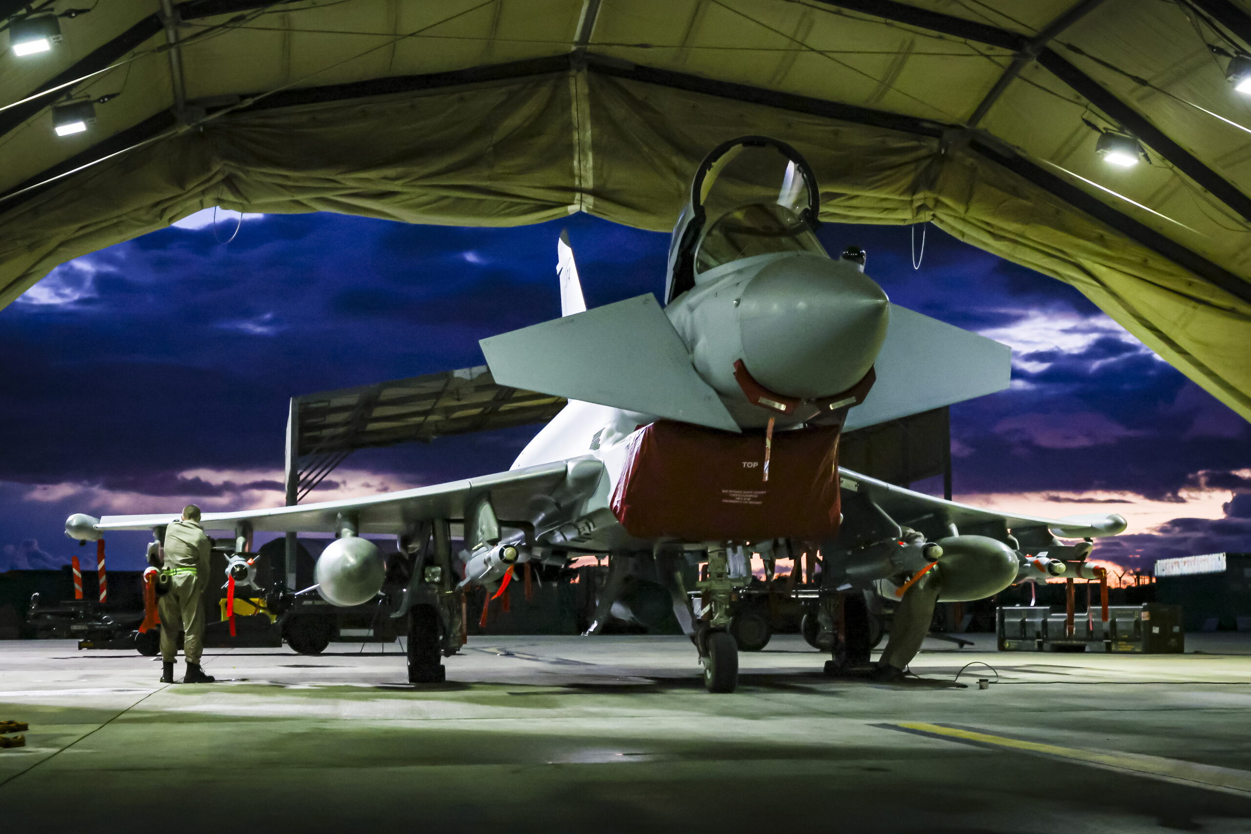 A handout photo made available by the British Royal Air Force of weapon technicians preparing a RAF Typhoon FRG4s aircraft to take-off to conduct further strikes against Houthi targets, on the RAF Akrotiri military airbase, in Akrotiri, Cyprus, 03 February 2024. RAF Typhoon aircraft have conducted a further set of strikes against Houthi military facilities in Yemen involved in their attacks against international shipping in the Red Sea.