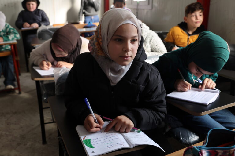 Refugee children attend their school class in a makeshift shelter at the Imam Ali Complex in Hermel, Bekaa Valley, near the border with Syria, northeastern Lebanon, 08 January 2026. The housing project, inaugurated on 11 December 2025, is a donation from Iran and was carried out under the supervision of Iranian engineers. It consists of 228 residential units housing at least 900 refugees, most of whom are Lebanese and Syrians from villages along the border who fled following the fall of the Syrian regime of ousted president Bashar al-Assad.