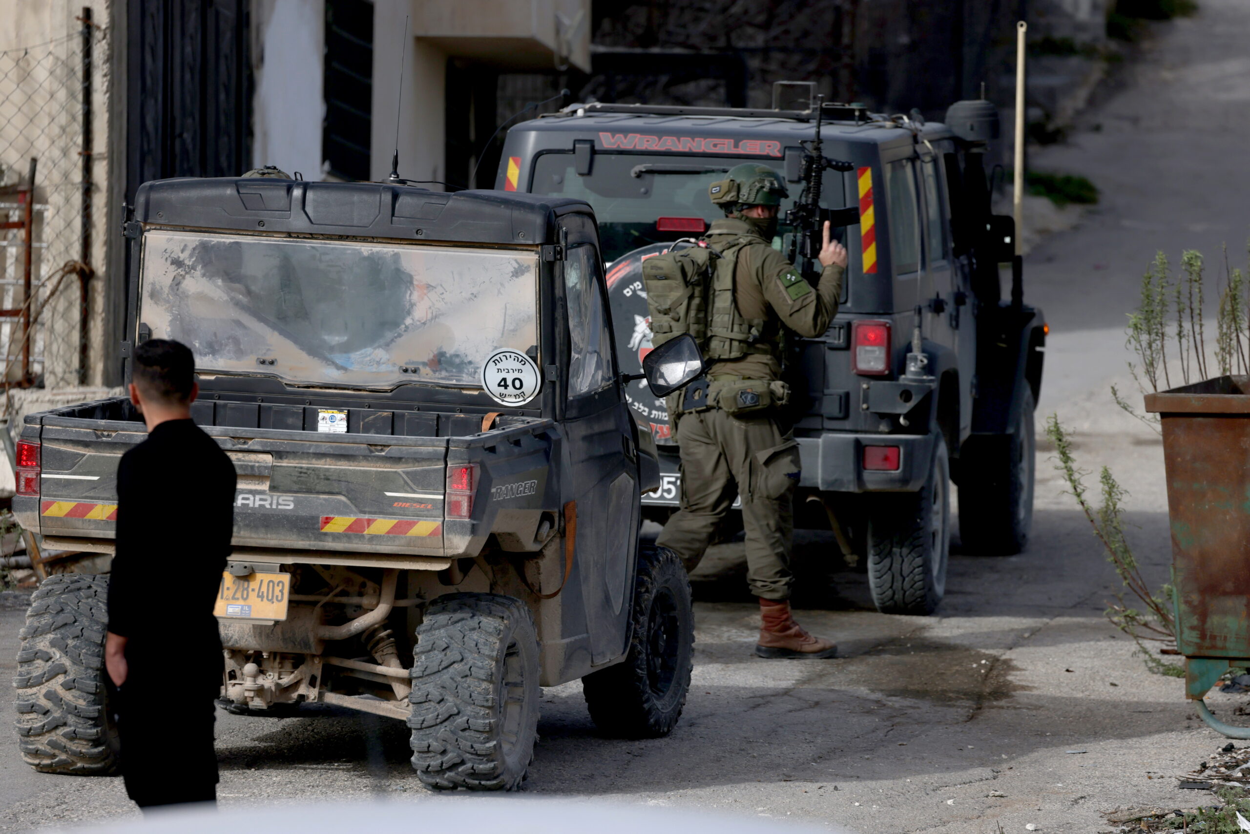 Palestinians watch as Israeli troops conduct a military raid in the village of Burqa, northwest of Nablus, West Bank, 02 February 2026. UNRWA Commissioner-General Philippe Lazzarini warned on 01 February that the territory is witnessing a 'silent war' where record violence by both the military and settlers since October 2023 has resulted in over 1,000 Palestinian deaths and the displacement of thousands. Lazzarini stated that the 'flagrant disregard for international humanitarian law has been normalized' and must stop before it is too late.