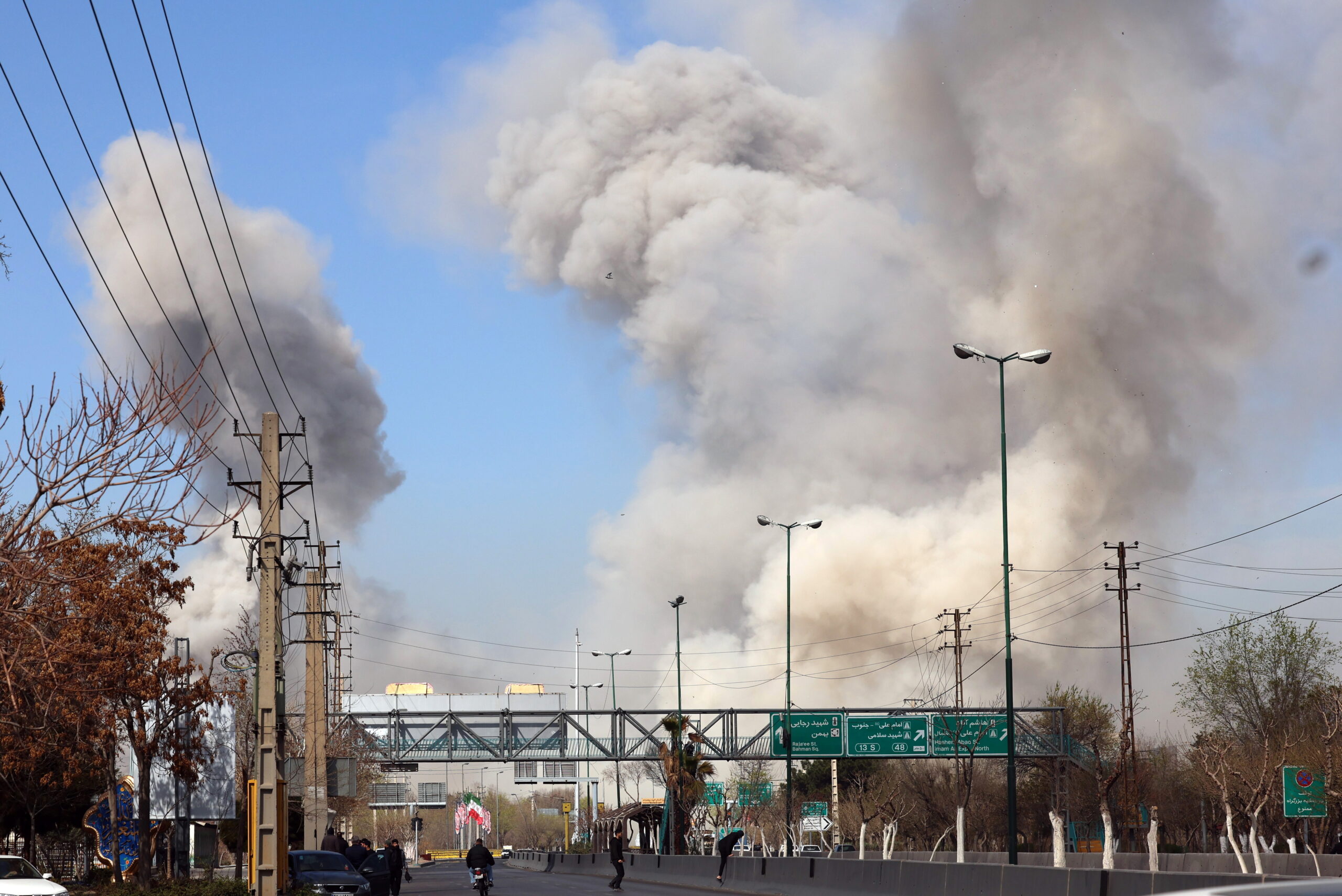 People run for safety as smoke rises after an airstrike in central Tehran, Iran, 05 March 2026. A joint Israeli and US military operation continues to target multiple locations across Iran since the early hours of 28 February 2026.