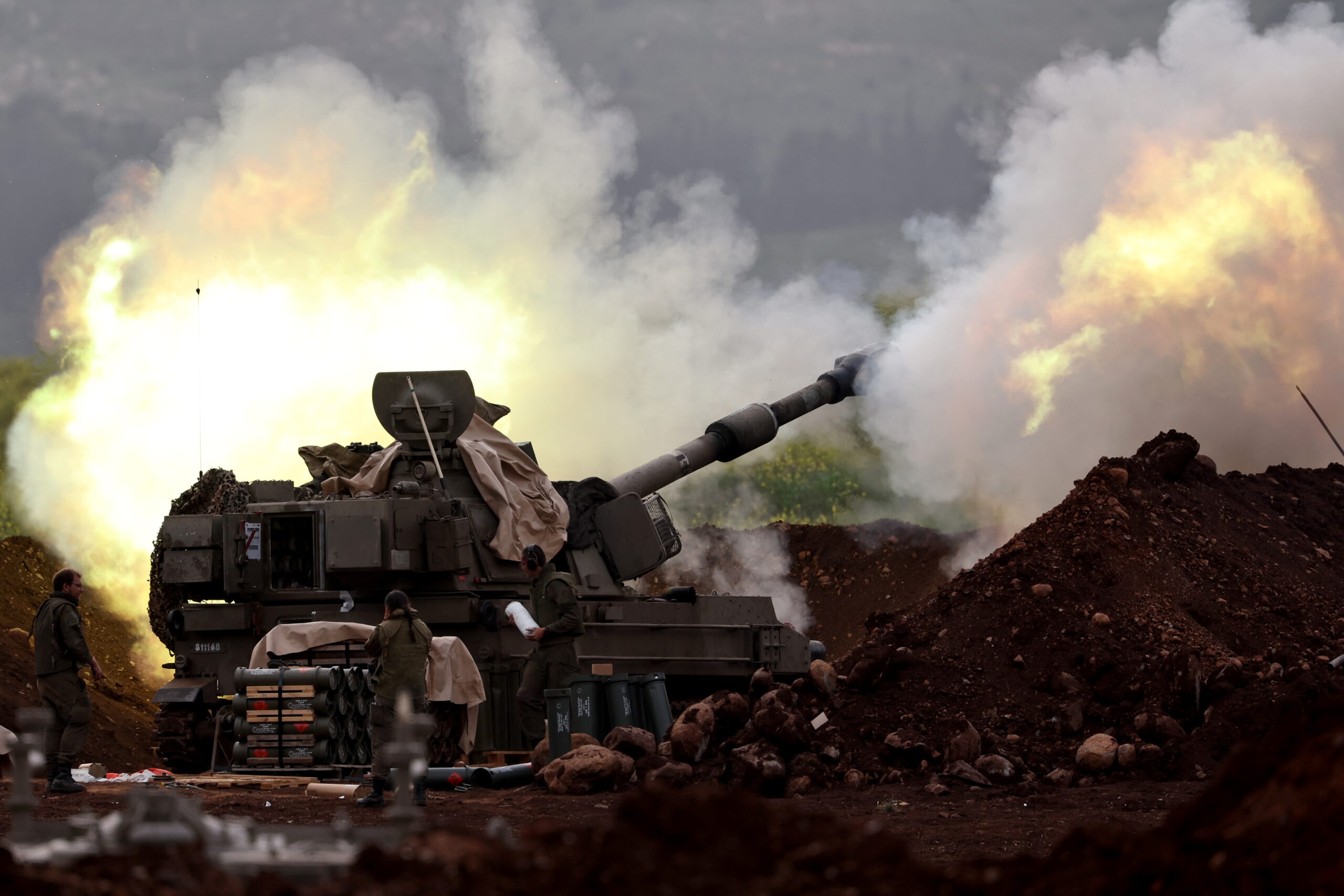 An Israeli artillery unit deployed at an undisclosed location at the Israeli border with Lebanon shells targets in Lebanon, 14 March 2026. The Israeli military stated it is conducting strikes across Lebanon targeting Hezbollah infrastructure and personnel.