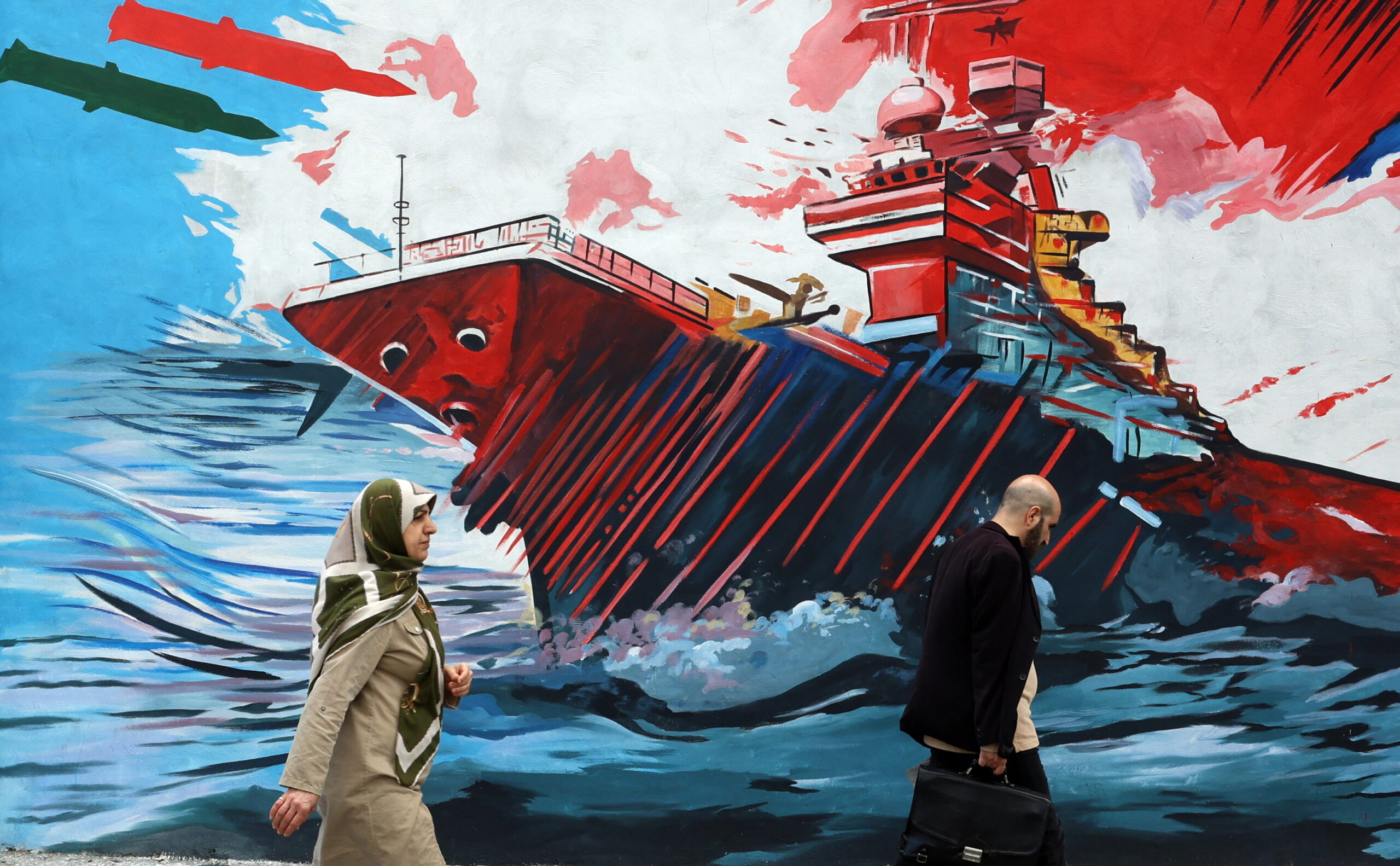 Iranians walk past an anti-USA and anti-Israel mural on a street in Tehran, Iran, 20 April 2026. Conflict between Iran and the US over the Strait of Hormuz continues as Iran again closed the strait, as the Iranian foreign ministry spokesman said on 20 April that Iran has no plan to participate in Pakistan talks with the US yet.