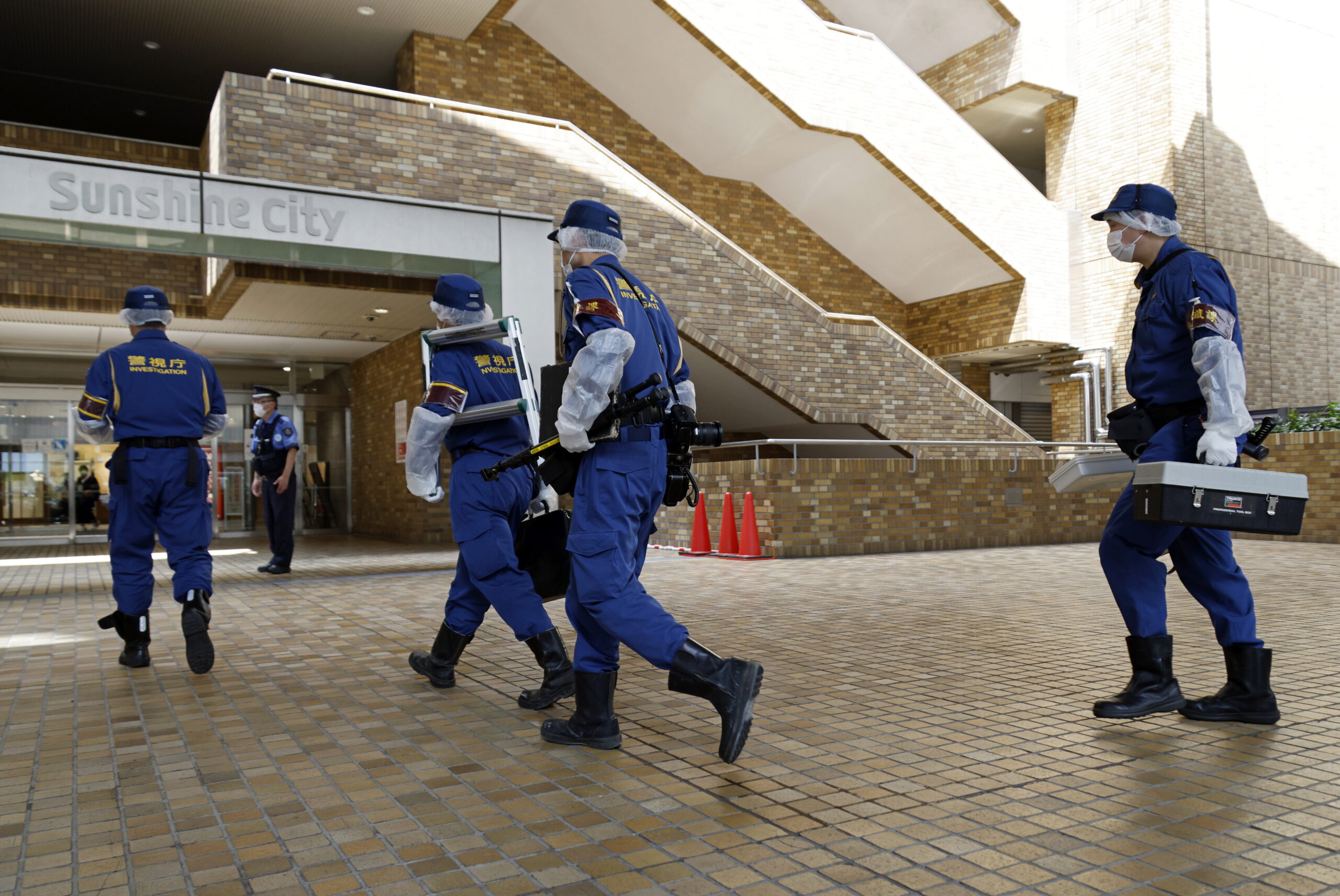Police investigation team officers walk on their way to enter the Sunshine City commercial facility in Tokyo, Japan, 01 July 2025. A law office employee had been stabbed with a knife on the 31st floor of Sunshine City, a commercial facility in Tokyo. According to the Sugamo Police Department, a man in his 30s was stabbed in the neck and other parts of his body and taken to the hospital, where he died shortly afterward.