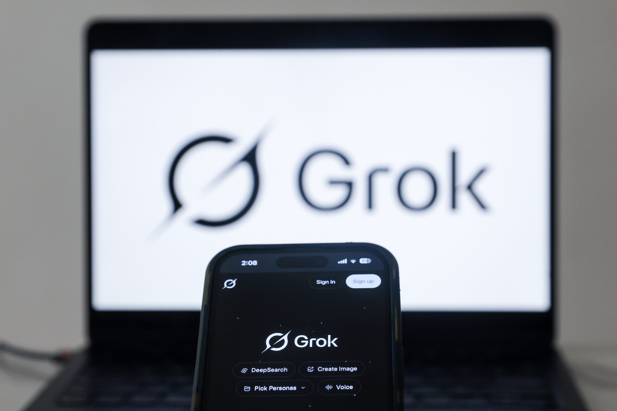 Grok artificial intelligence (AI) website is displayed on a mobile phone as a nationwide restriction on the service takes effect, in Shah Alam, outside Kuala Lumpur, Malaysia 12 January 2026. The Malaysian Communications and Multimedia Commission (MCMC) ordered a temporary block on the tool starting 11 January, citing its 'repeated misuse' to generate non-consensual sexually explicit images and 'grossly offensive' content. According to the regulator, the action was taken after social media platform X and xAI, the start-up behind Grok, failed to implement adequate technical safeguards despite multiple formal notices.