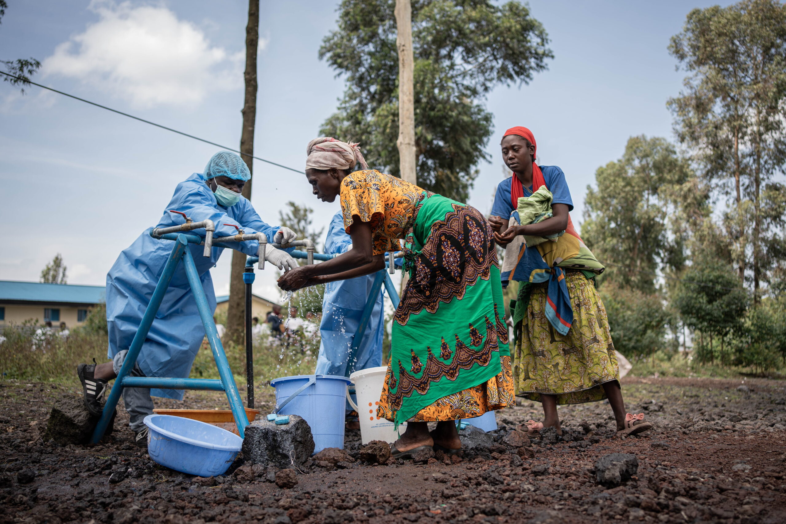 Locals wash their hands at a checkpoint set up for preventive measures against the spread of Ebola in Kanyaruchinya, near Goma, North Kivu, Democratic Republic of Congo, 27 May 2026. The World Health Organization (WHO) has declared the Ebola outbreak, caused by the Bundibugyo virus, in the Democratic Republic of the Congo a public health emergency of international concern.