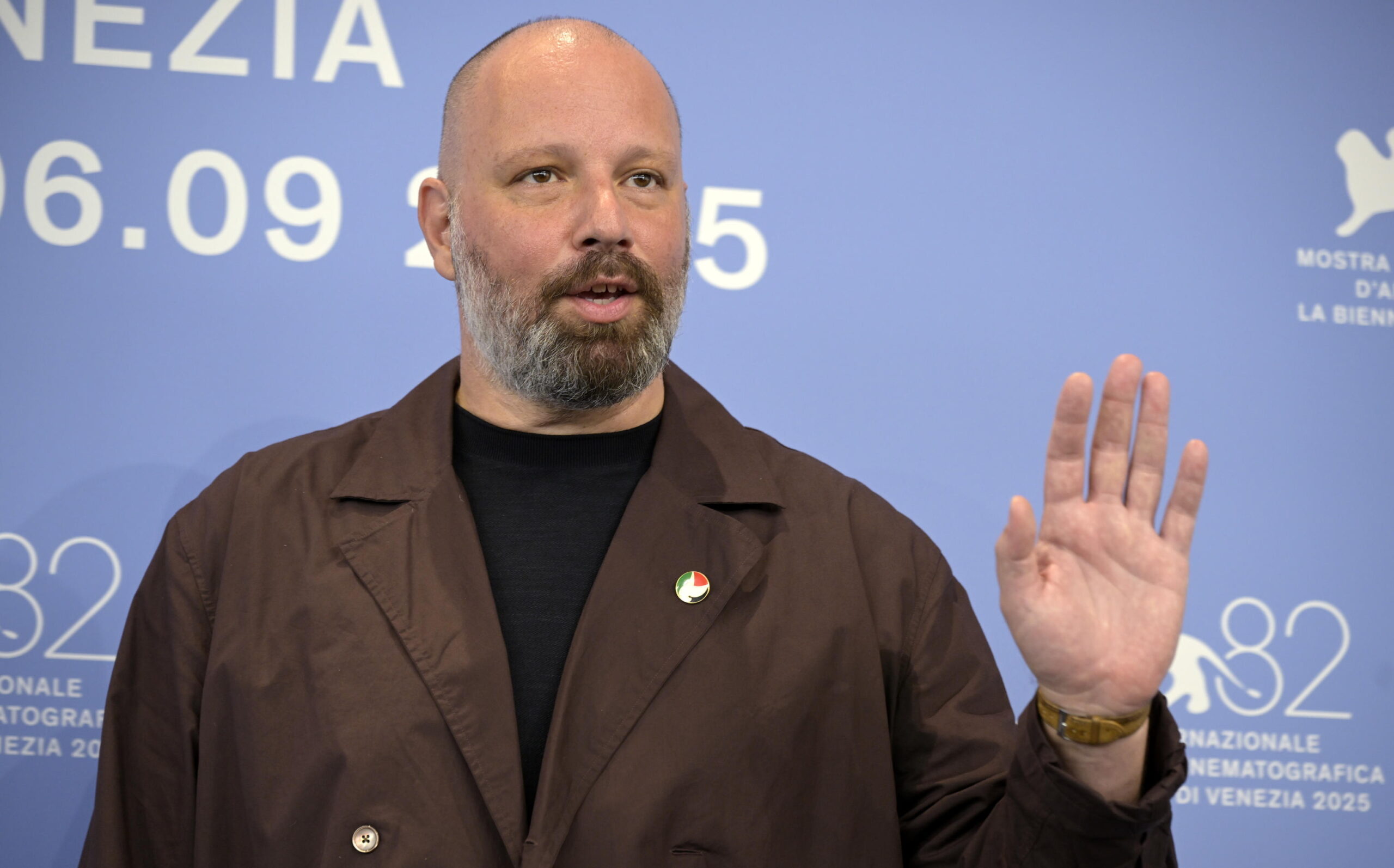 Greek director Yorgos Lanthimos poses wearing a pin of the Palestinian flag at a photocall for 'Bugonia' during the 82nd annual Venice International Film Festival, in Venice, Italy, 28 August 2025. The film festival runs from 27 August to 06 September 2025.