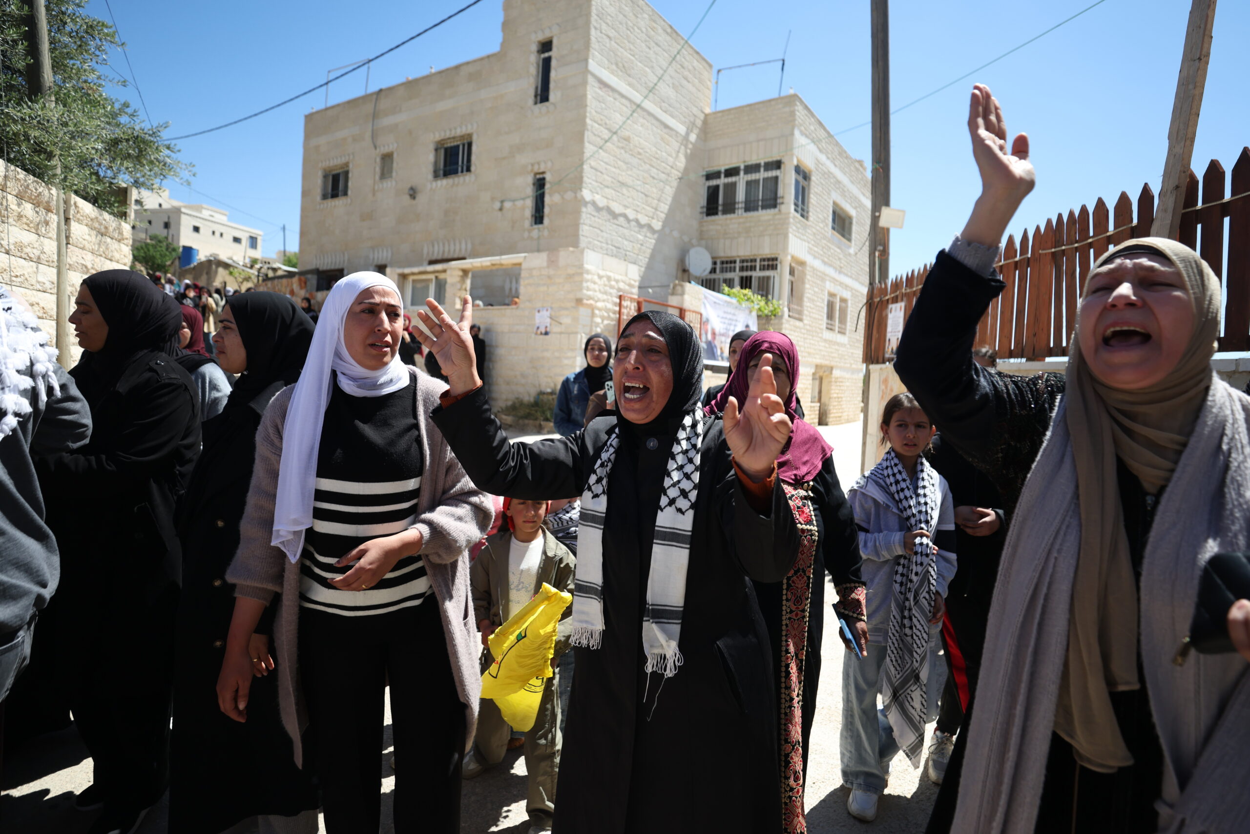 Relatives of Palestinian teenager Aws Hamdi Al-Naasan mourn during his funeral in the village of Al-Mughayyir, east of the West Bank city of Ramallah, 22 April 2026. According to the Palestinian news agency WAFA, two Palestinians were killed by Israeli settlers gunfire during an attack on Al-Mughayyir, east of Ramallah, on 21 April. Four others were reportedly injured in the incident.
