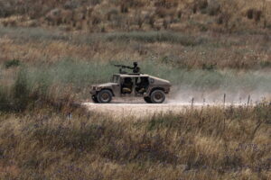 A military vehicles moves within southern Lebanon, as seen from the Israeli side of the border in the Upper Galilee, northern Israel, 17 June 2026. An Israeli army spokesperson reported that a soldier was severely injured, two soldiers were moderately injured, and two additional soldiers were lightly injured as a result of an explosive drone impact in southern Lebanon.