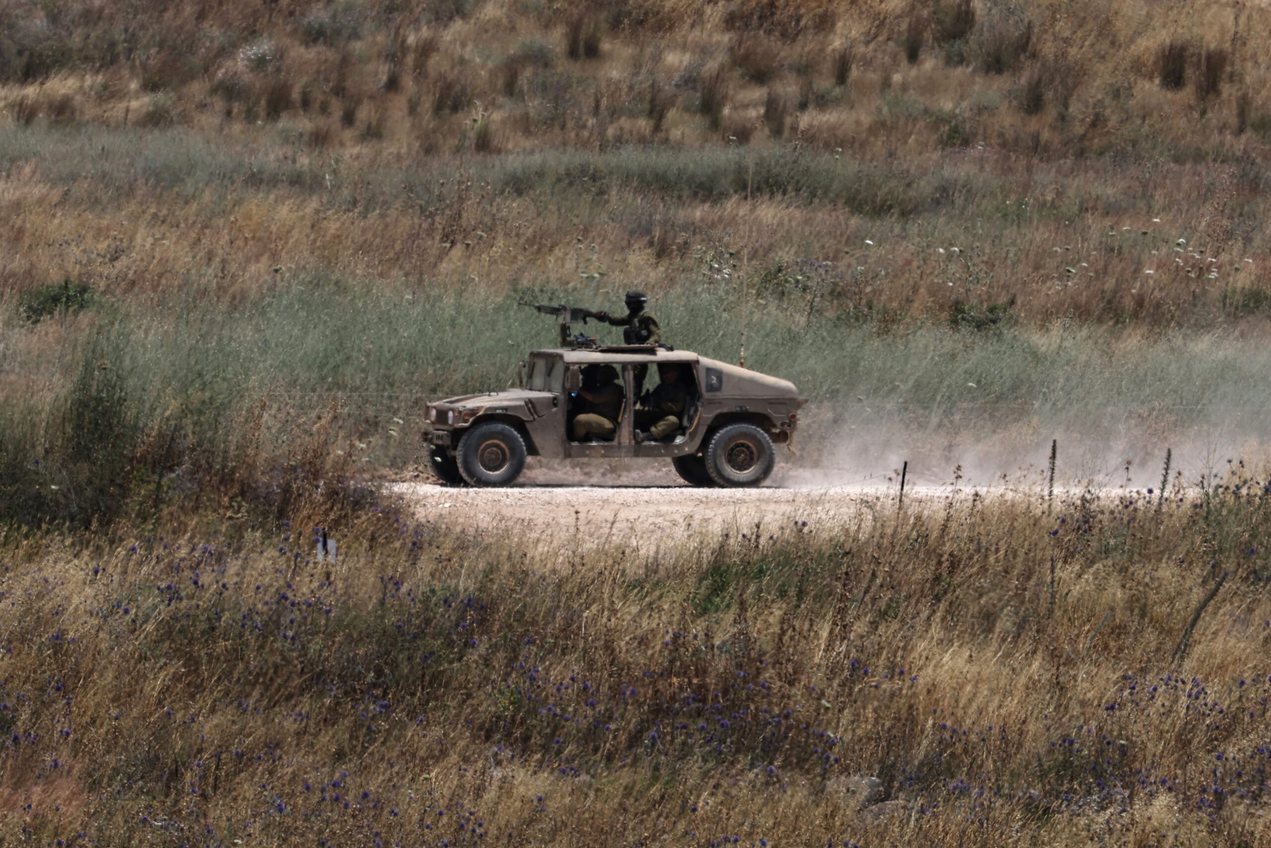 A military vehicles moves within southern Lebanon, as seen from the Israeli side of the border in the Upper Galilee, northern Israel, 17 June 2026. An Israeli army spokesperson reported that a soldier was severely injured, two soldiers were moderately injured, and two additional soldiers were lightly injured as a result of an explosive drone impact in southern Lebanon.