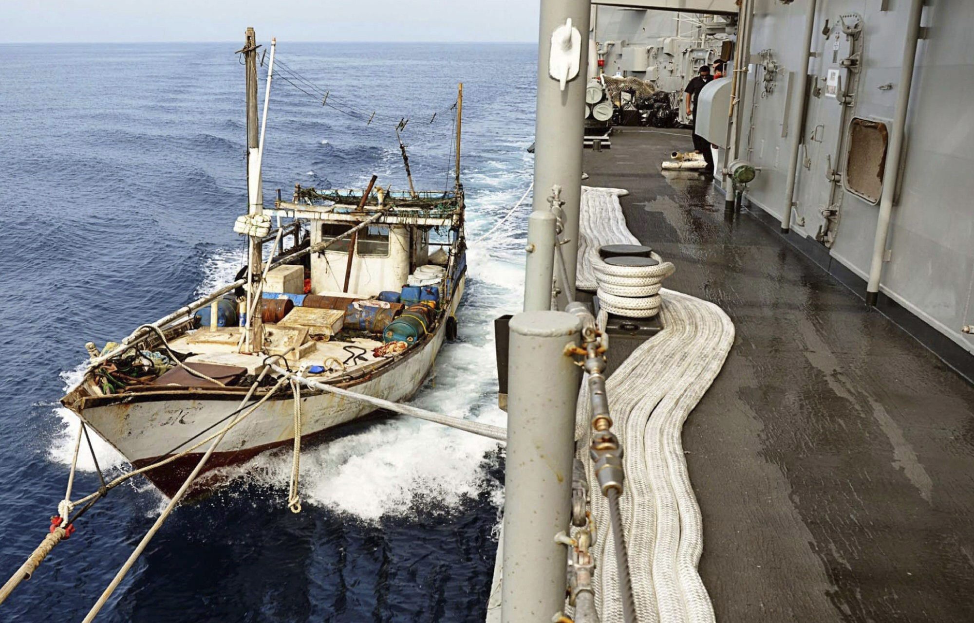 epa03188850 An undated handout picture released by the Spanish Defence Ministry in Madrid on 19 April 2012 shows the fishing ship 'Nimesha Duwa', sailing under Sri Lankan flag, that was kidnapped by Somalian pirates six months ago towed to the Spanish patrol ship 'Infanta Elena' after beeing freed in Tanzania's waters. The 'Nimesha Duwa' ship reportedly was kidnapped by Somali pirates in the coastal waters of Sri Lanka six months ago and has since then been used as a supply ship by pirates. The fishing ship could have been involved in a failed attack of a mechant ship at thwe Mozambique channel the last weekend, sources at the Spanish Defence Ministry said 19 April.