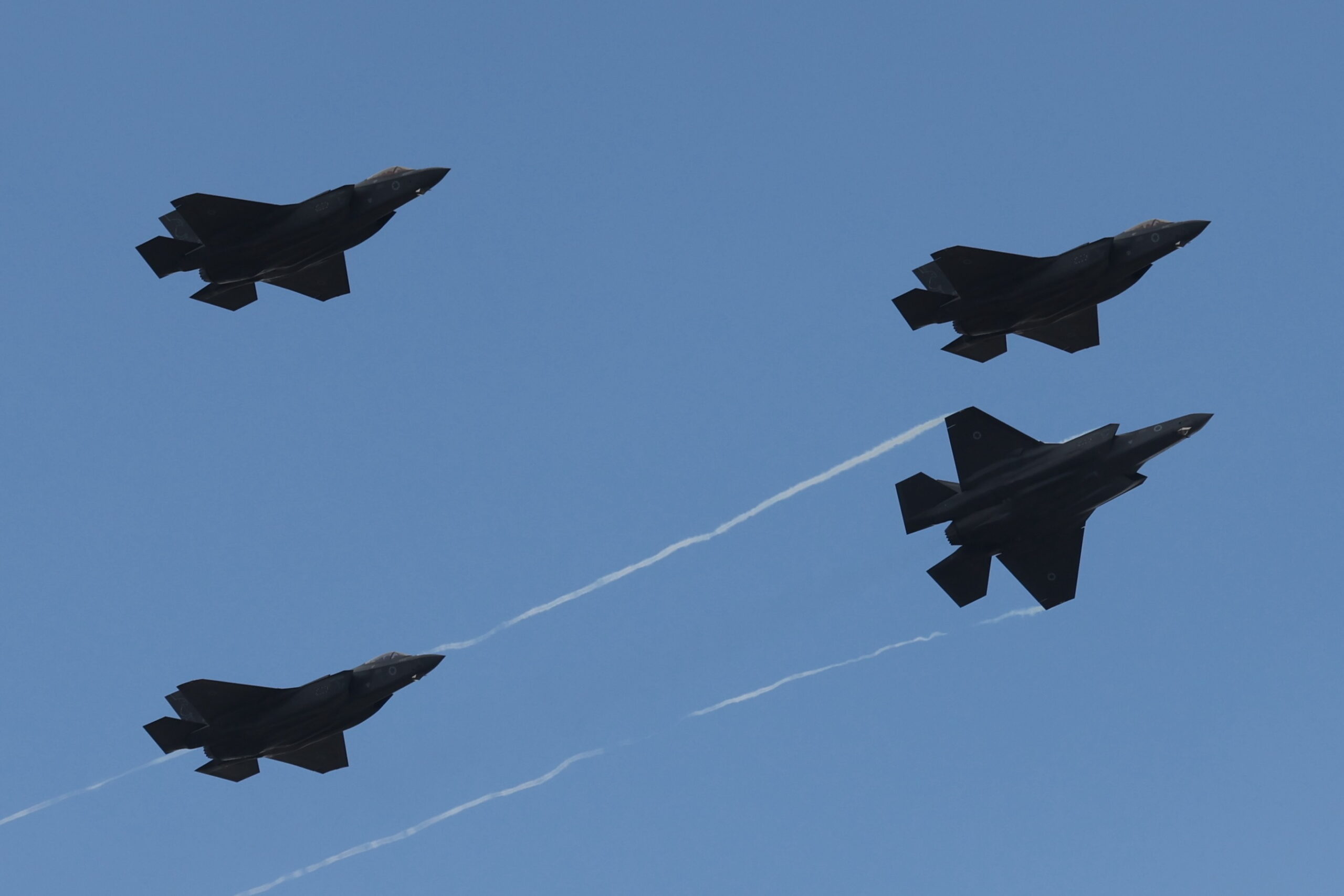 epa12904006 Four Israeli air force F-35 fighter jets perform an honor flyover as two minutes sirens sound across the country in Mount Herzl military national cemetery in Jerusalem, 21 April 2026, as Israel marks the Memorial Day for fallen soldiers.