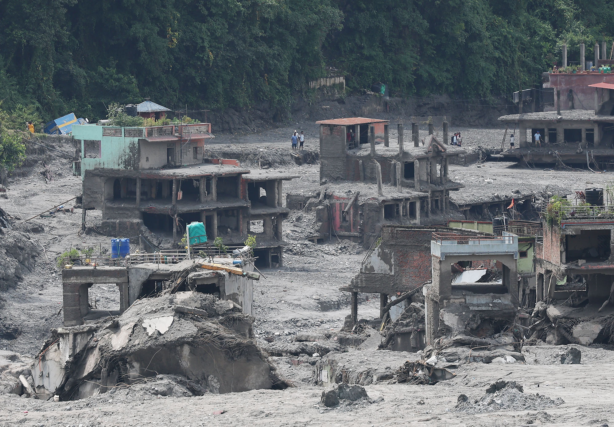 epa13198291 Houses are seen in ruins in Bidur, Nepal, 29 August 2026, following flash floods earlier this week. More than 600 people were killed, and hundreds remain missing across northern Nepal after a glacial collapse and avalanche triggered flash floods and mudslides along the Bhotekoshi and Trishuli river valleys near the Nepal-Tibet border, causing widespread destruction to settlements and infrastructure, according to the National Disaster Risk Reduction and Management Authority (NDRRMA).