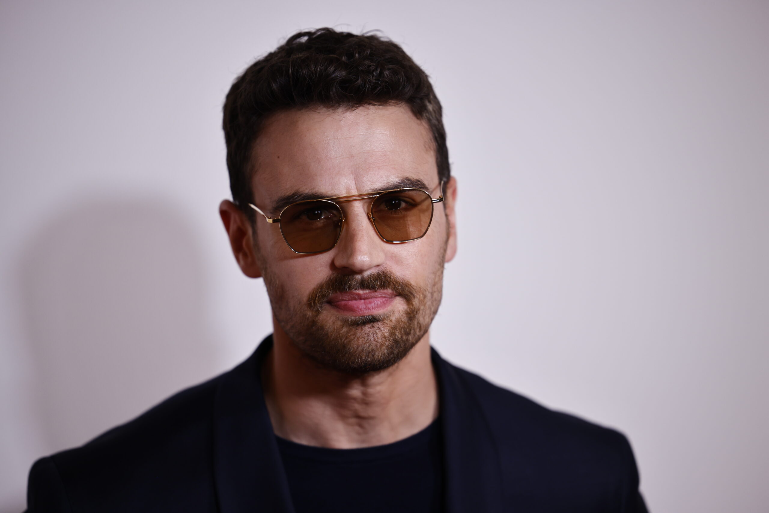 epa10977170 British actor Theo James poses upon arrival at the GQ Men of the Year Awards 2023 at the Royal Opera House in London, Britain, 15 November 2023.