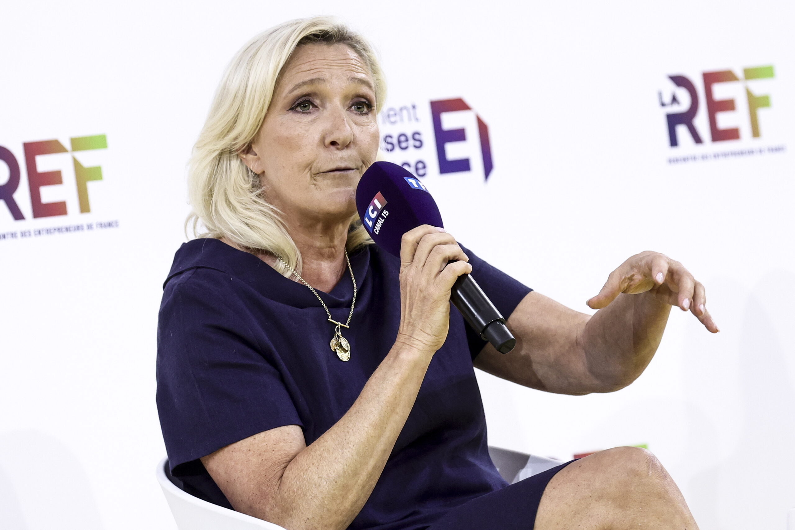 epa13194775 Candidate for the French presidency for Rassemblement National party Marine Le Pen speaks at the French employers federation MEDEF Summer Conference, La REF 2026, at Roland Garros in Paris, France, 27 August 2026.