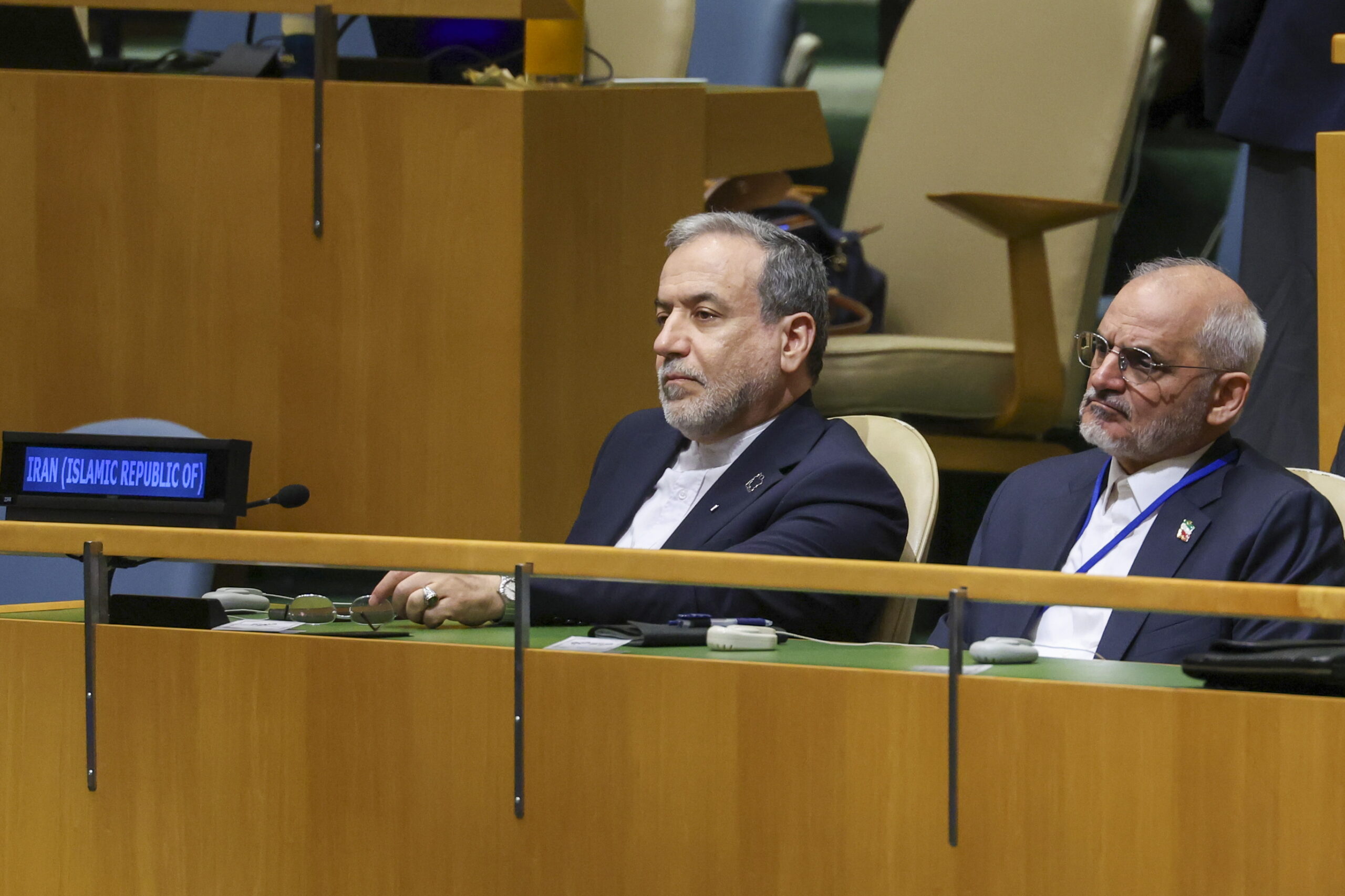 Minister of Foreign Affairs of Iran Abbas Araghchi (C) listens as President of Iran Masoud Pezeshkian speaks during the General Debate of the 81st session of the United Nations General Assembly at United Nations Headquarters in New York, New York, USA, 23 September 2026.