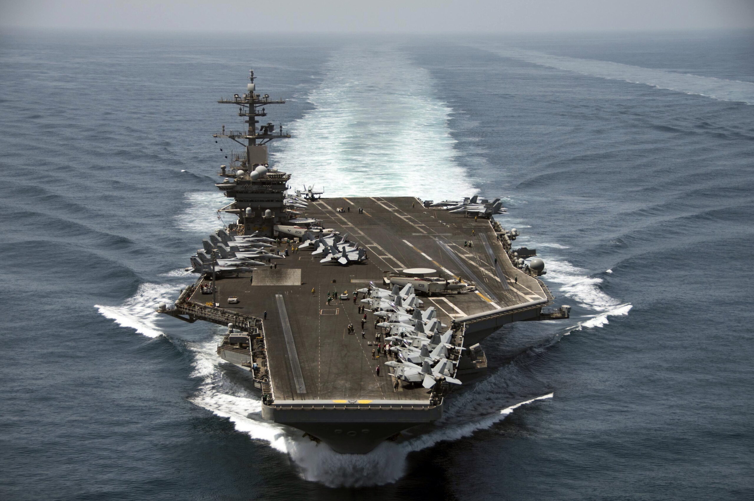 epa08335877 (FILE) - An aerial handout image made available by US Navy showing the aircraft carrier USS Theodore Roosevelt (CVN 71) operating in the Arabian Sea on 21 April 2015 (reissued 01 April 2020). According to reports, Captain Brett Crozier, captain of the US aircraft carrier Theodore Roosevelt, which is currently docked in Gua, has penned a letter calling for decisive action to be taken to avert deaths on the carrier.