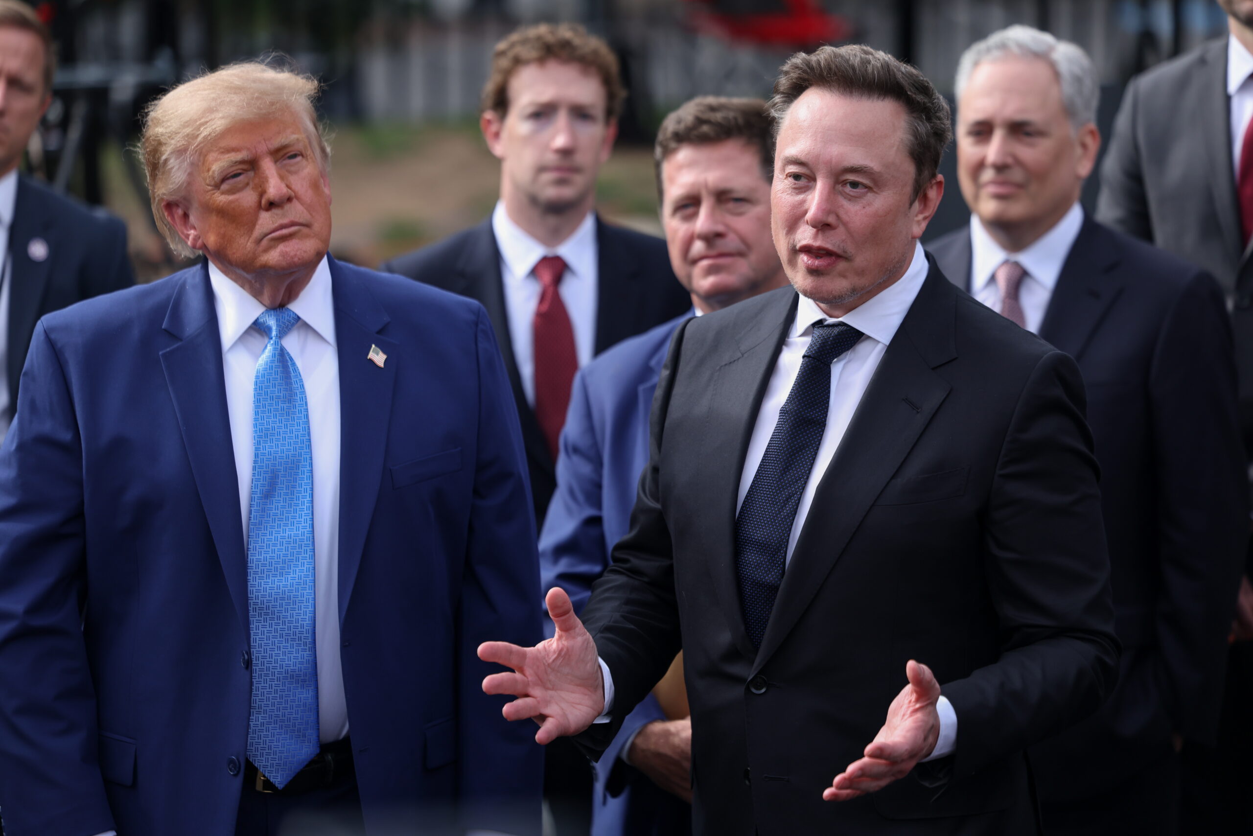 epa13271670 US President Donald Trump (L) listens as Tesla, X and SpaceX CEO Elon Musk (R) speaks to reporters after a meeting on super intelligence with tech executives at the White House in Washington, D.C., USA, 29 September 2026. Nvidia CEO Jensen Huang and House Speaker Mike Johnson also attended.