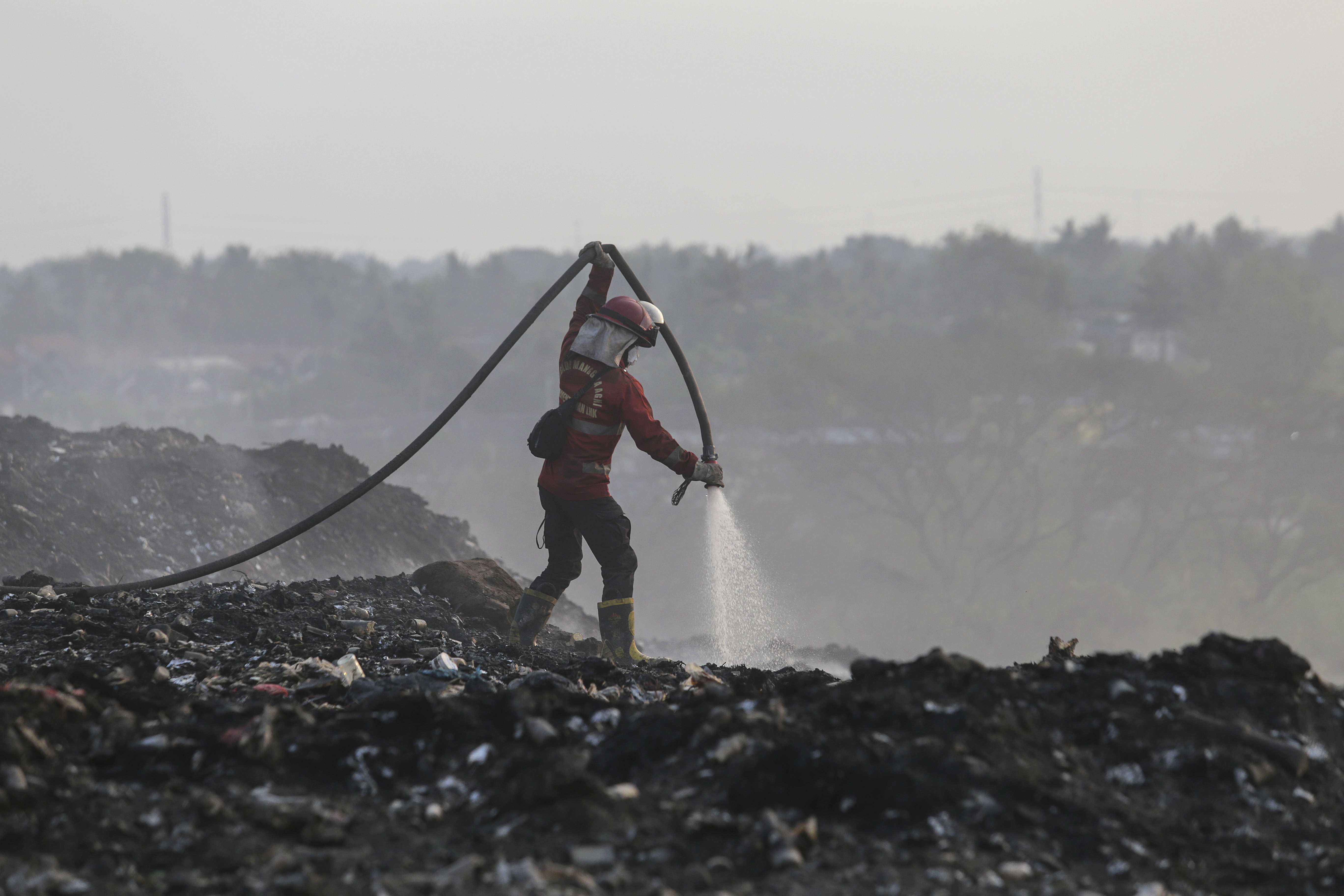 Jatiwaringin landfill fire on Jakarta's outskirts continues for over a week
