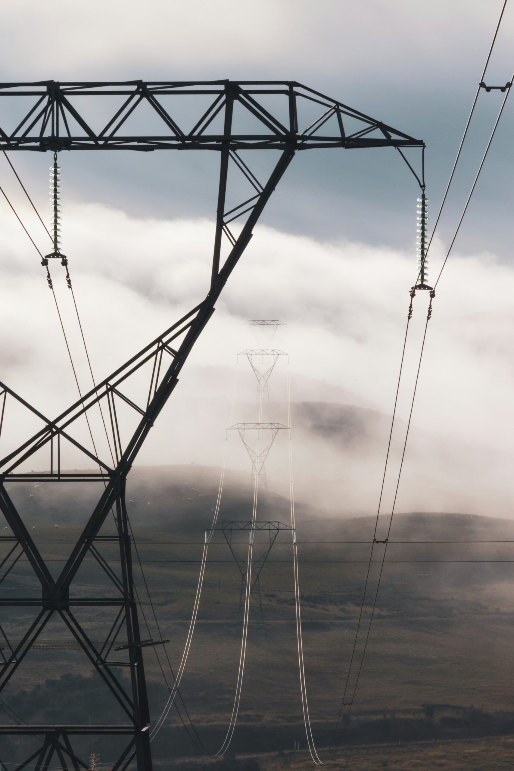 A power line with clouds in the background